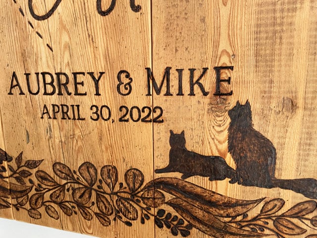 Family pets are included on this wedding sign