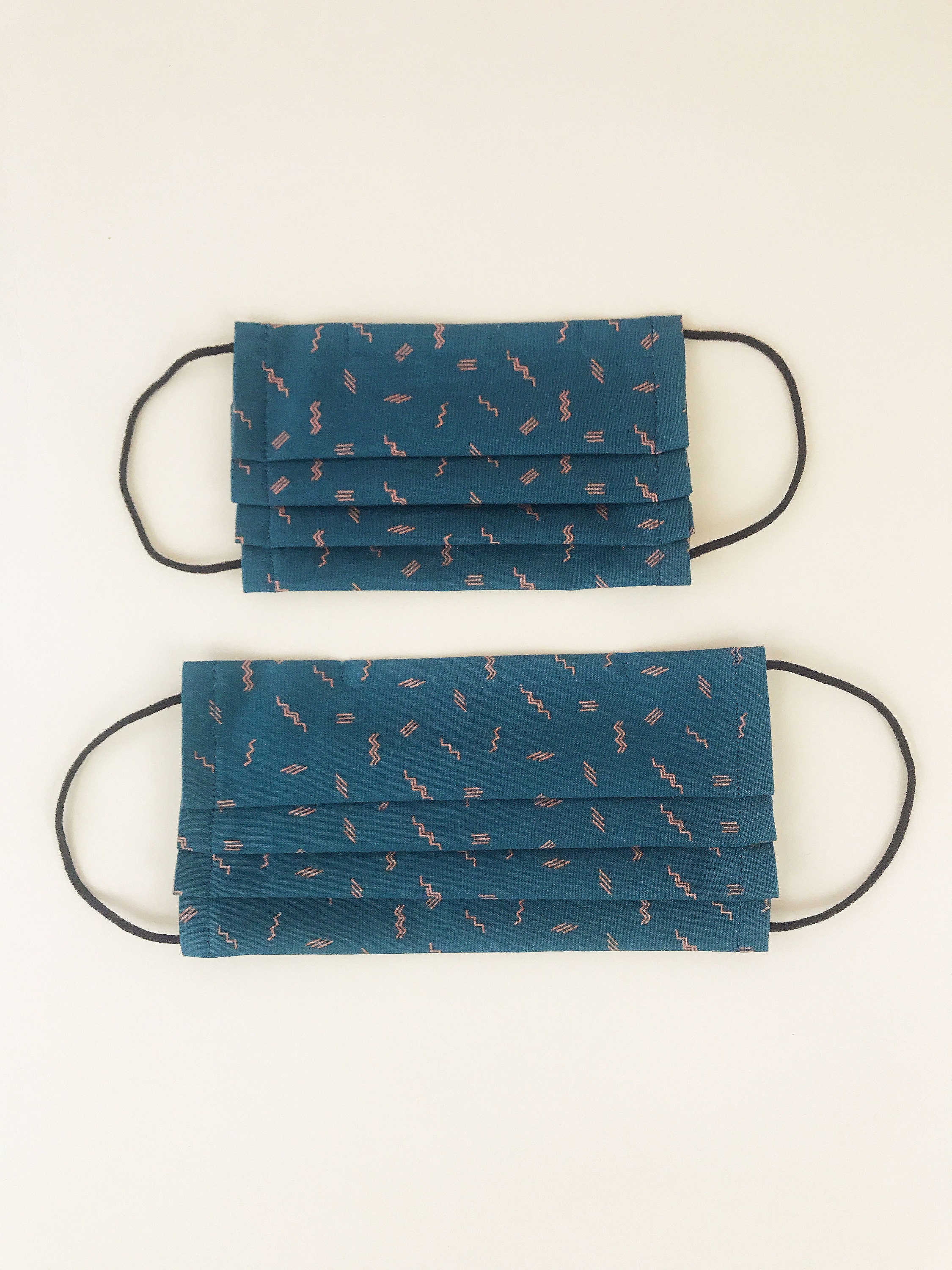 Pleated face masks for adults and children in dark teal