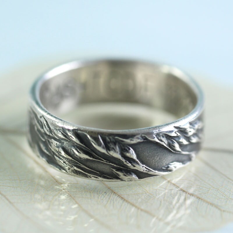 Silver band ring with grass imprint