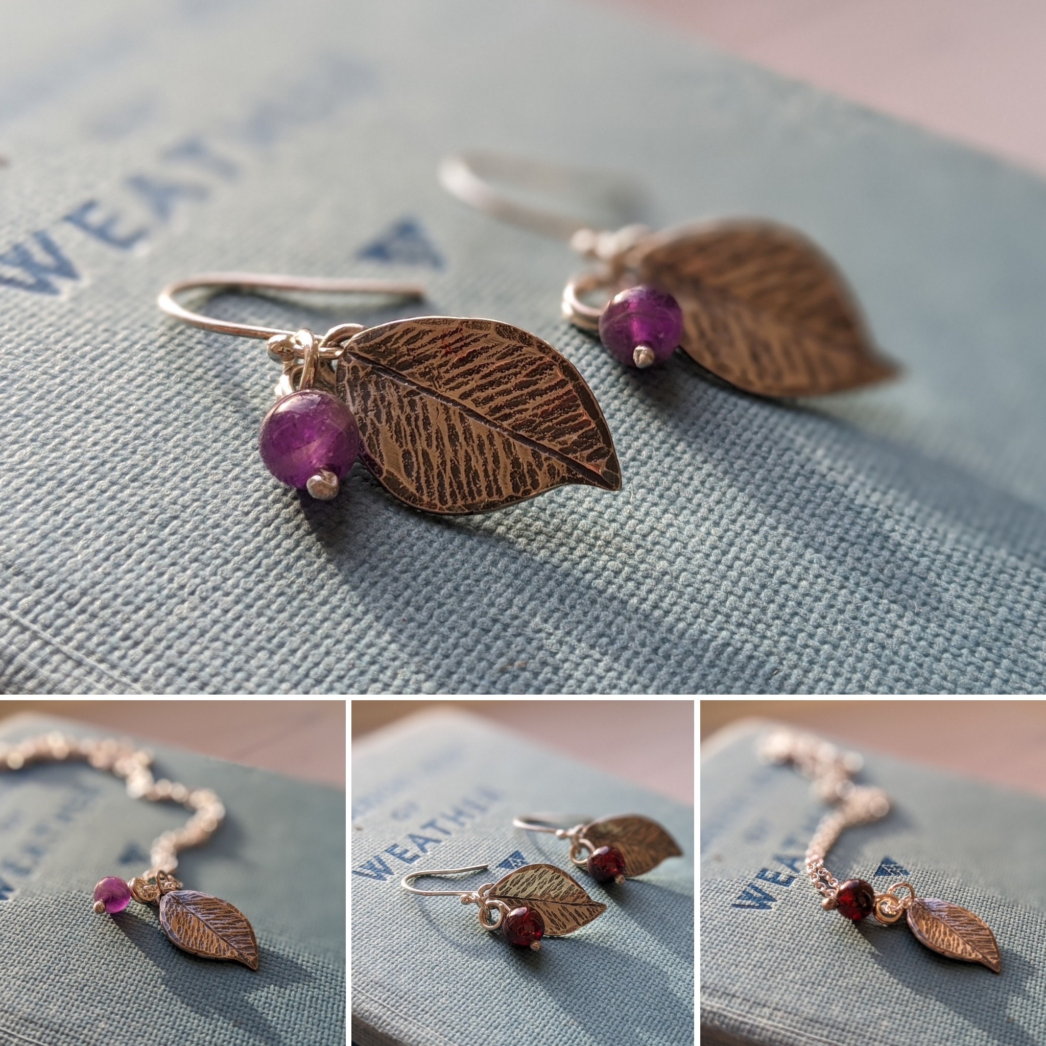 Colour photograph composed of four shots. Two are earrings, two pendants. All are in the form of silver leaves with amethyst and garnet bead berries
