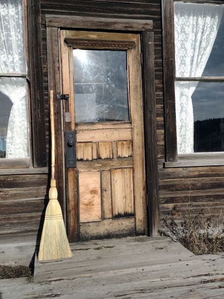 homestead cabin porch broom