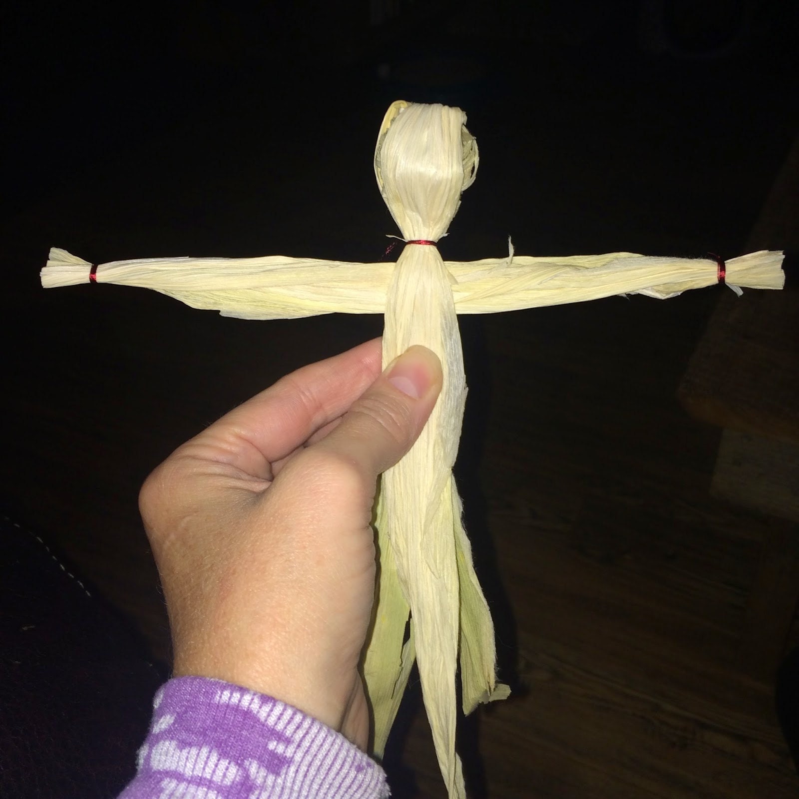 Boy corn dolly with legs separated and tied at knee and feet