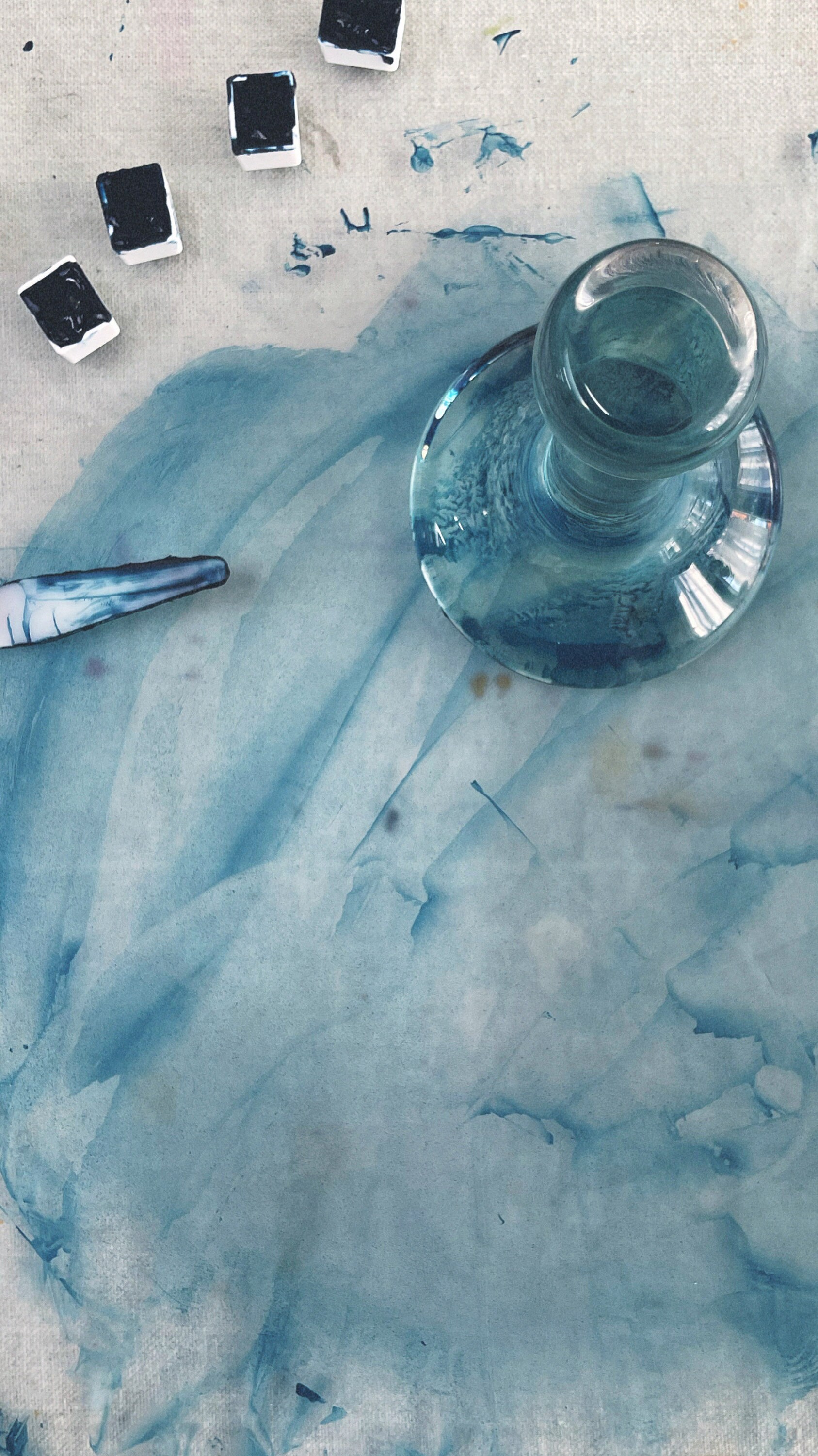 Our filled containers of Maya Blue paint, lined up next to the muller.