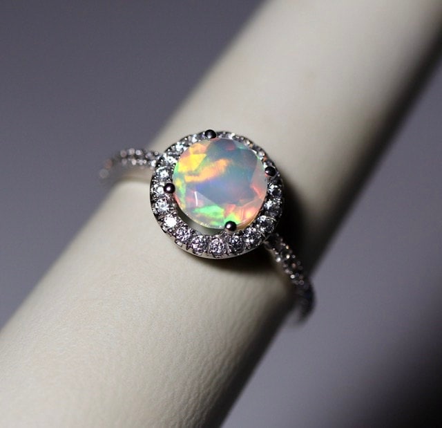 I can’t believe that I haven’t received a review for these two absolutely amazing opal rings in 14K white gold halo ring setting. The opals were just a dream in both rings.