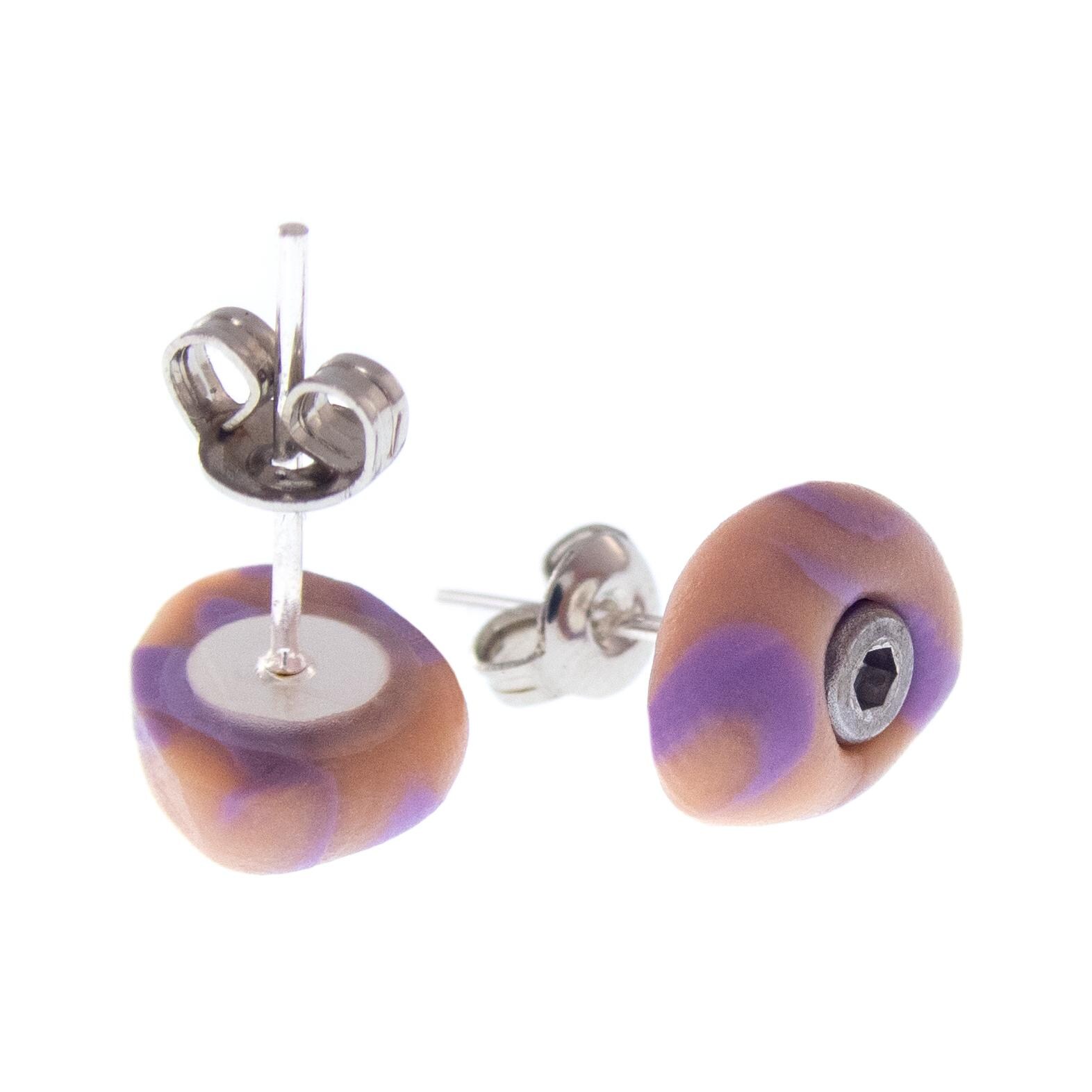 Tiny climbing hold studs inspired by real bouldering gym equipment, crafted by Nadamlada