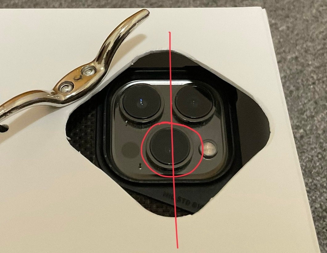 Line up the bottom camera in the center of the Cool Fence Cam hole.