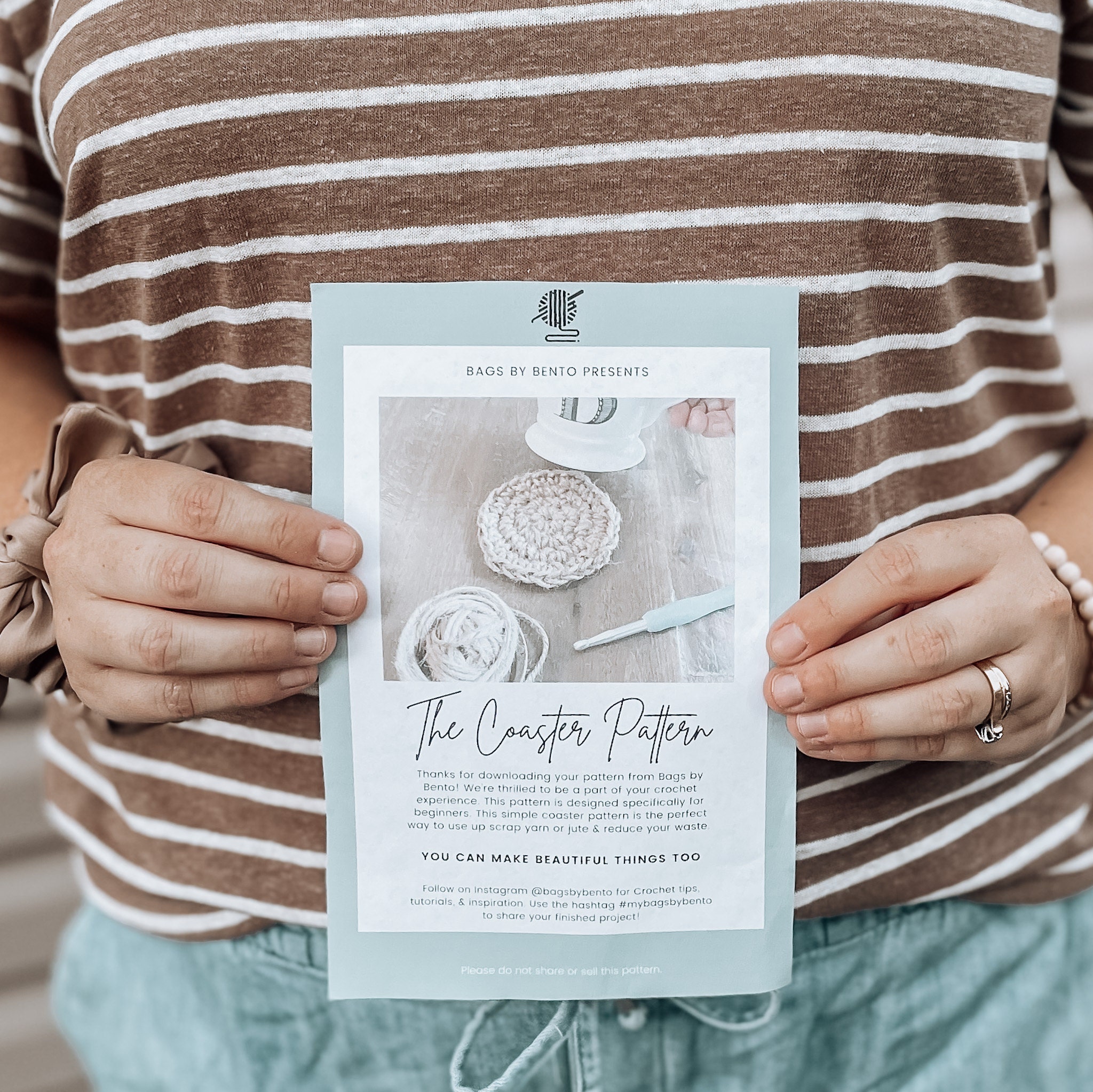 Woman holding crochet pattern