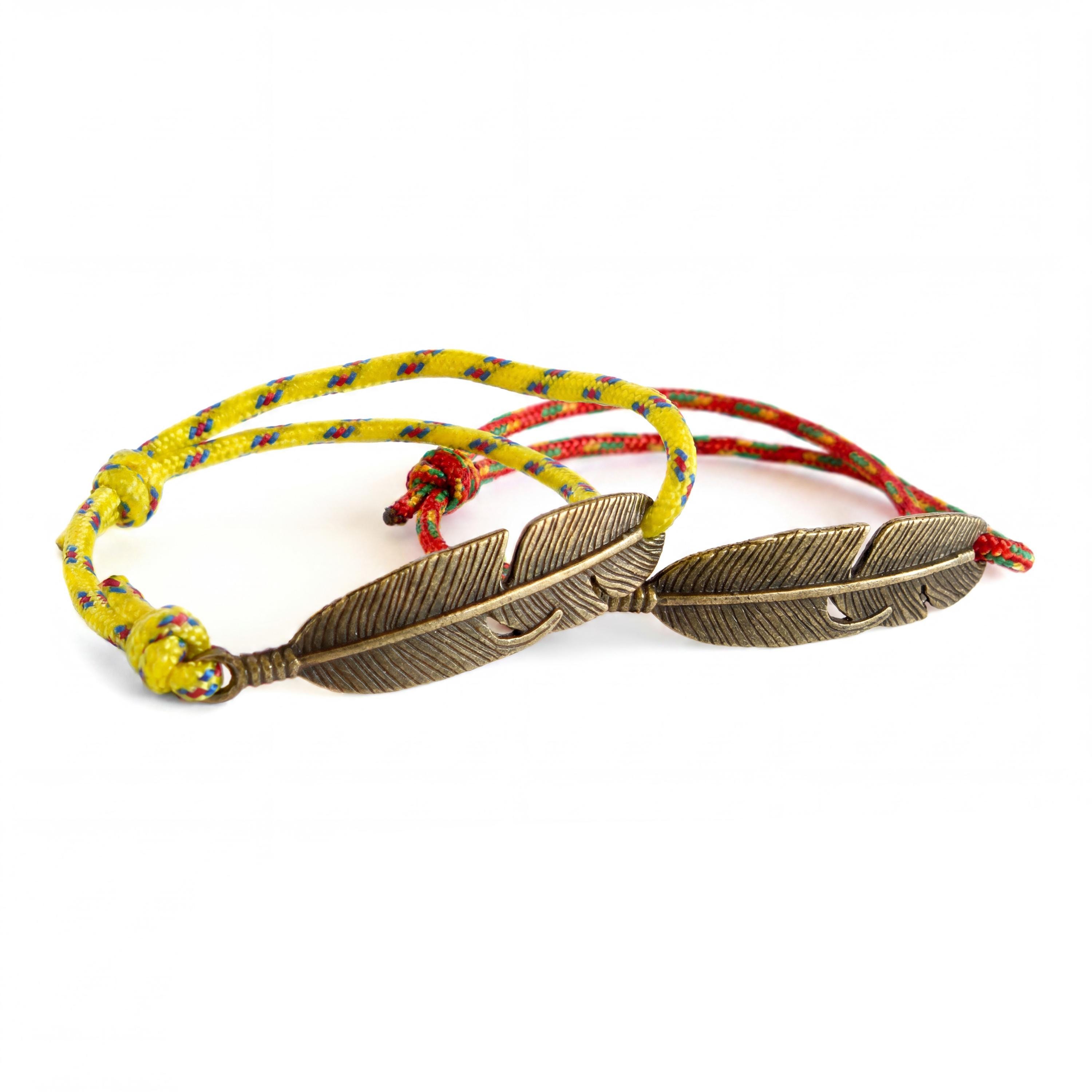 Feather charm rope bracelet symbolizing freedom, travel, and connection to nature, inspired by climbing and surf culture handmade jewelry design.