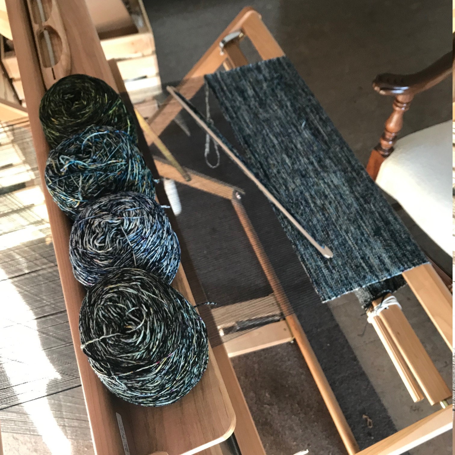 Saori loom with Malabrigo Mechita Speckled weft scarves.