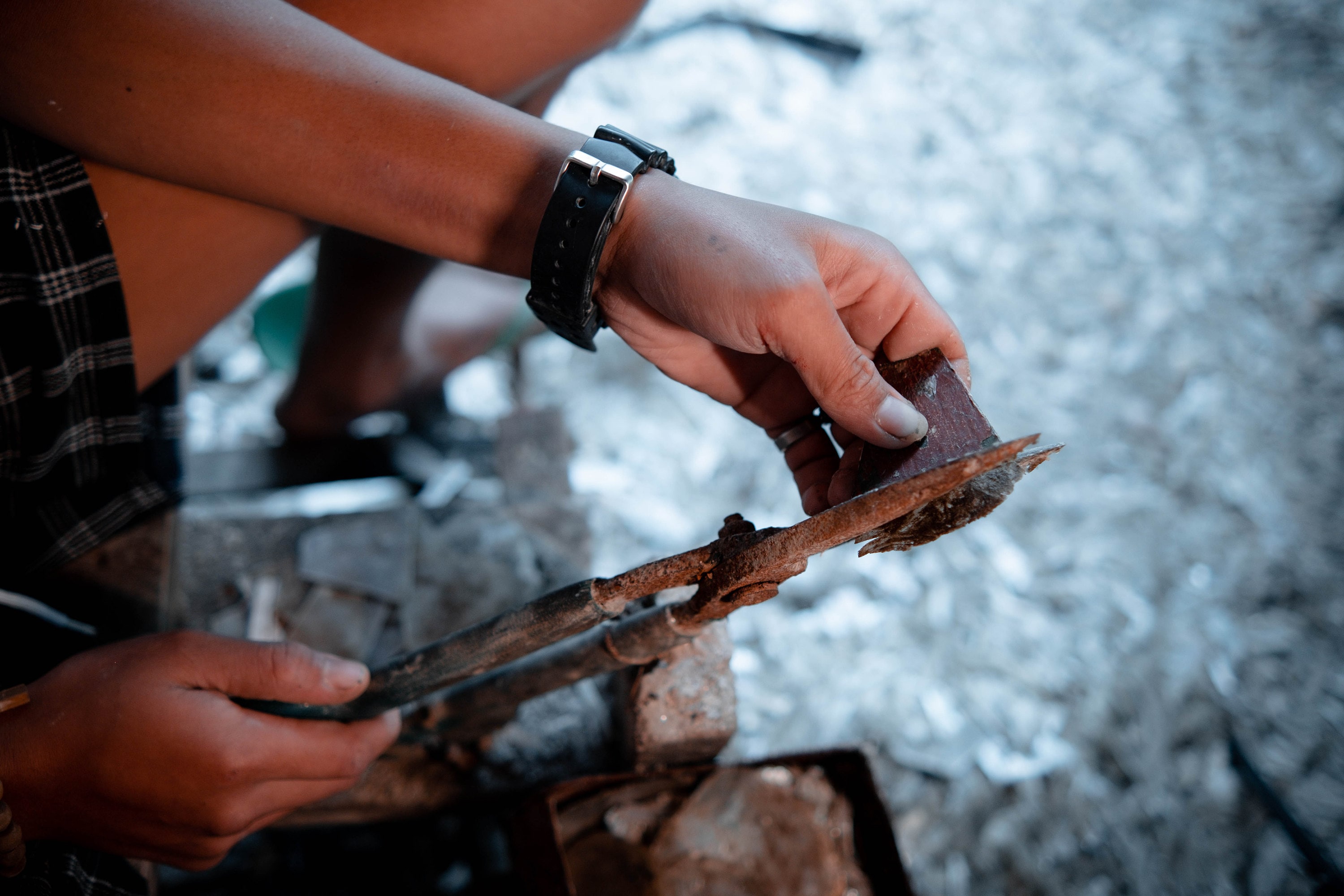 Capiz shell being cut to size