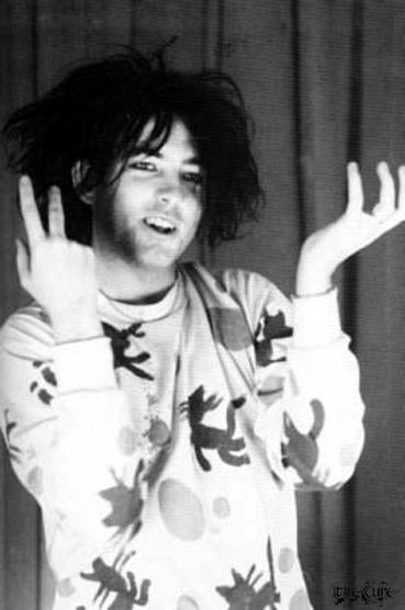 Robert Smith wearing his Lovecats sweatshirt.