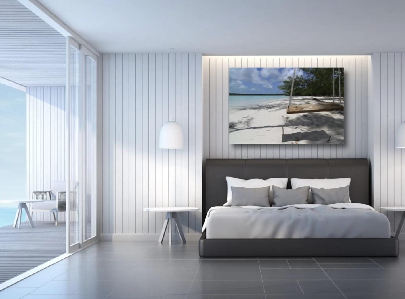 A bright coastal bedroom with a beach scene artwork