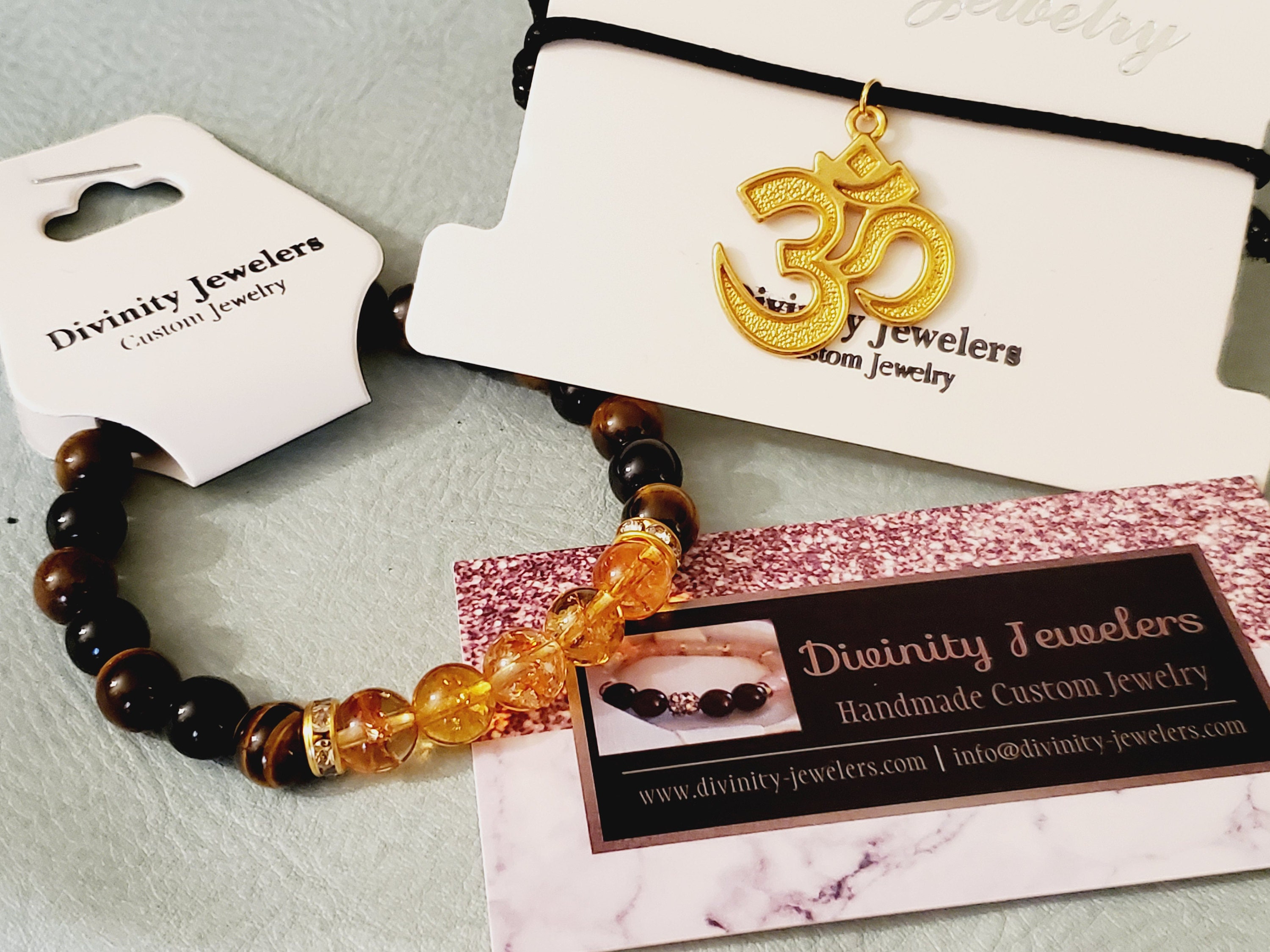 free 18k gold plated Ohm charm adjustable bracelet with any store purchase!