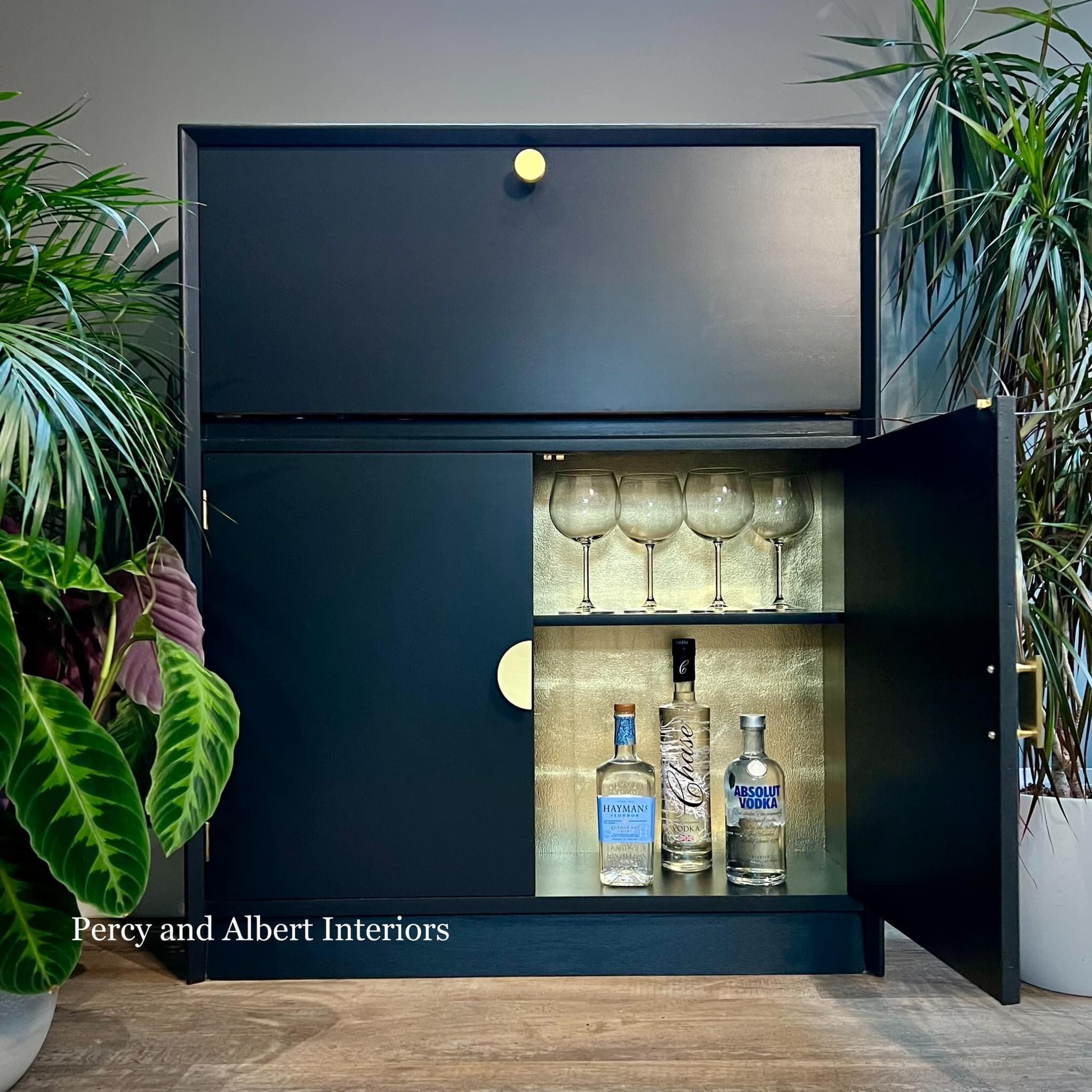 Black cocktail cabinet with gold leaf