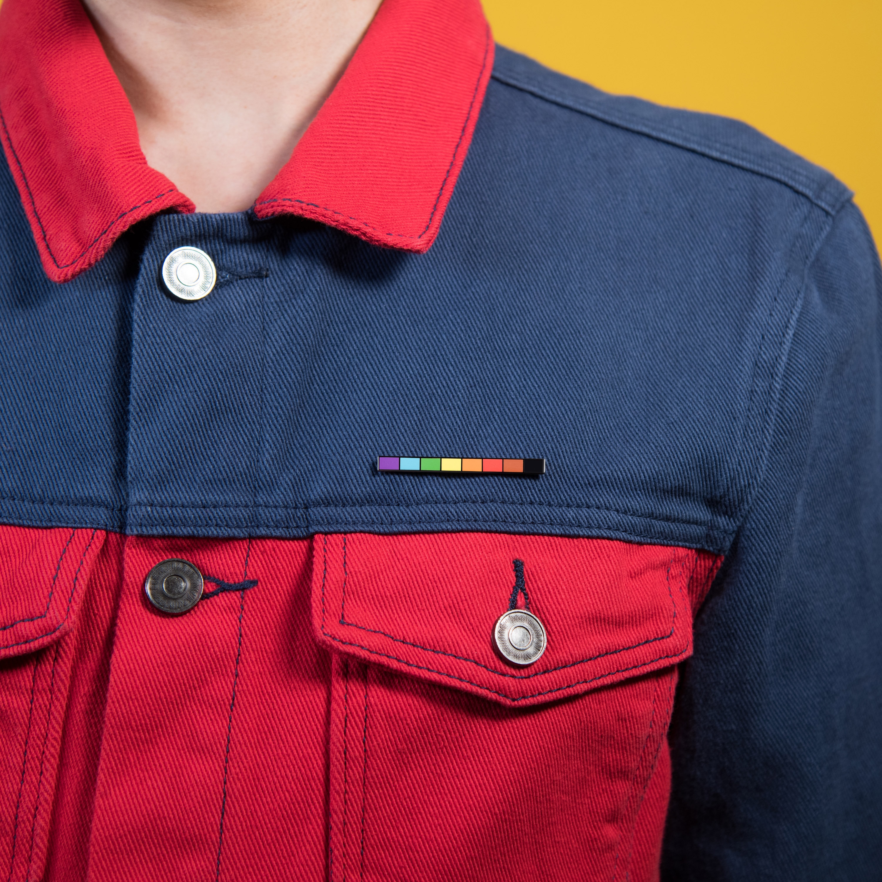 Subtle minimalist rainbow pride pins for office and school. showing gay pride at work on uniform.