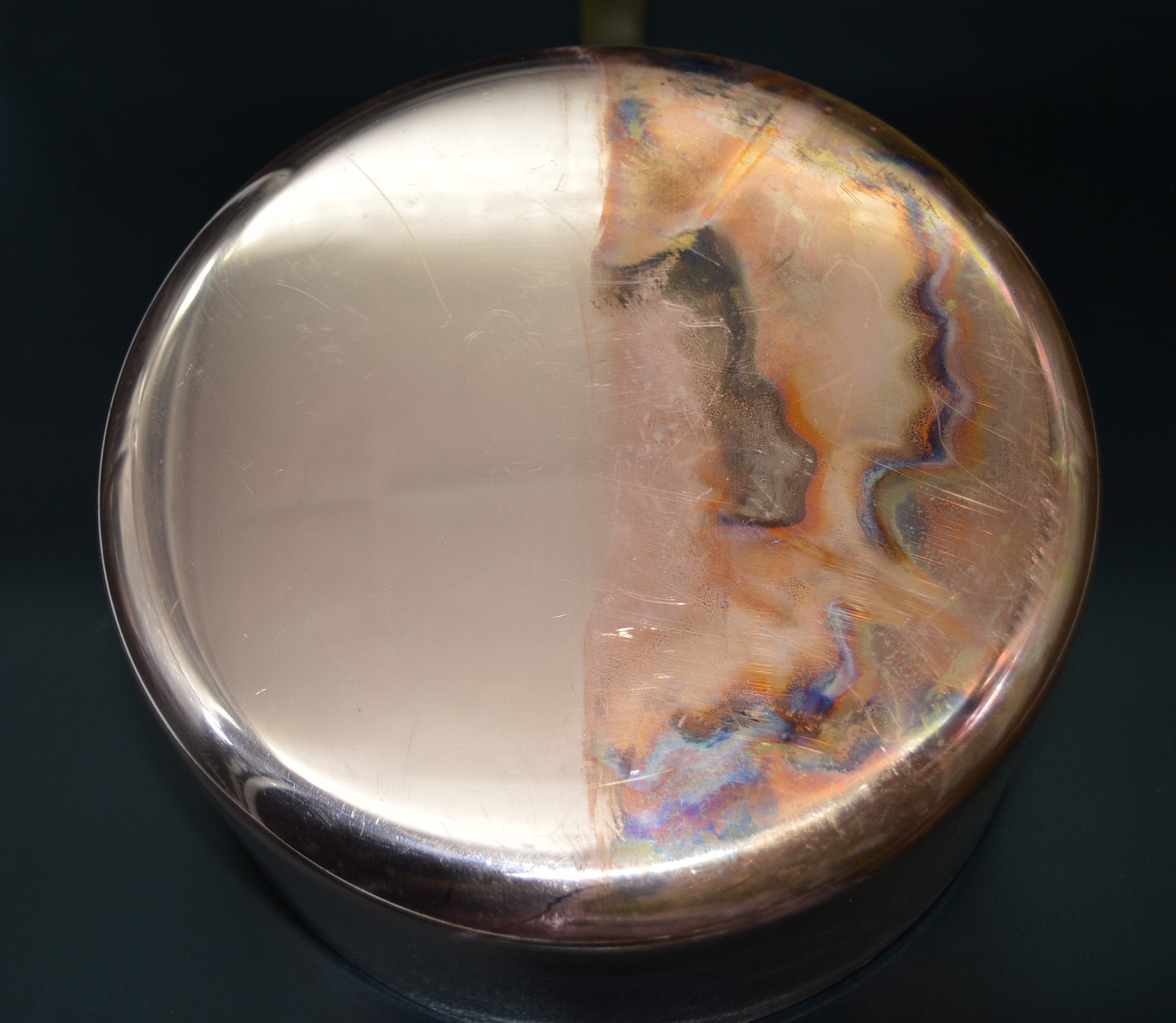 Half has been cleaned with a metal polish and the other half