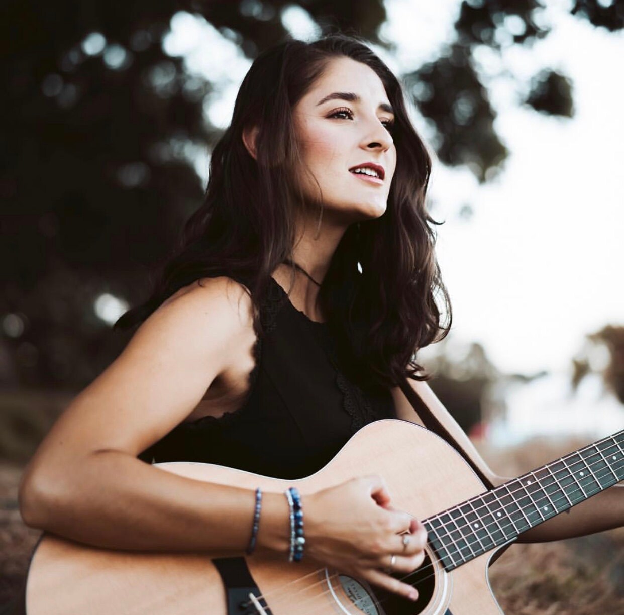 Lauren Collins Singer wearing Starcut Sodalite and Crystal bracelet set