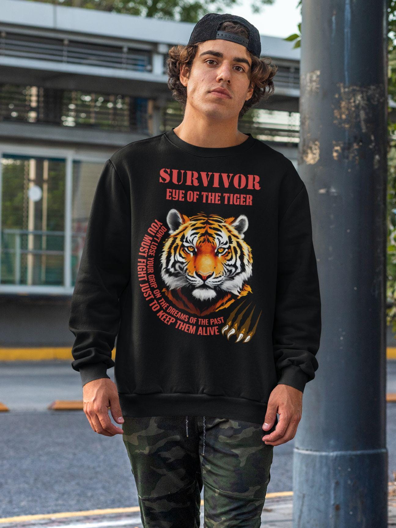 Man wearing the retro Eye of the Tiger shirt, featuring the iconic tiger graphic and Survivor song lyrics.