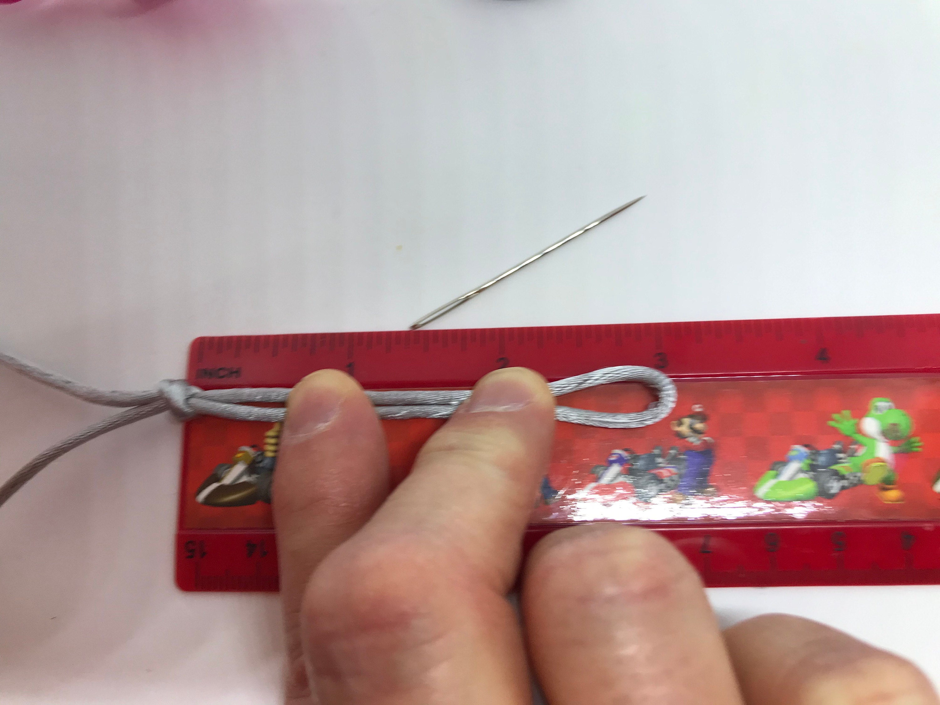 Showing a loop knot with 3 inches at the end.