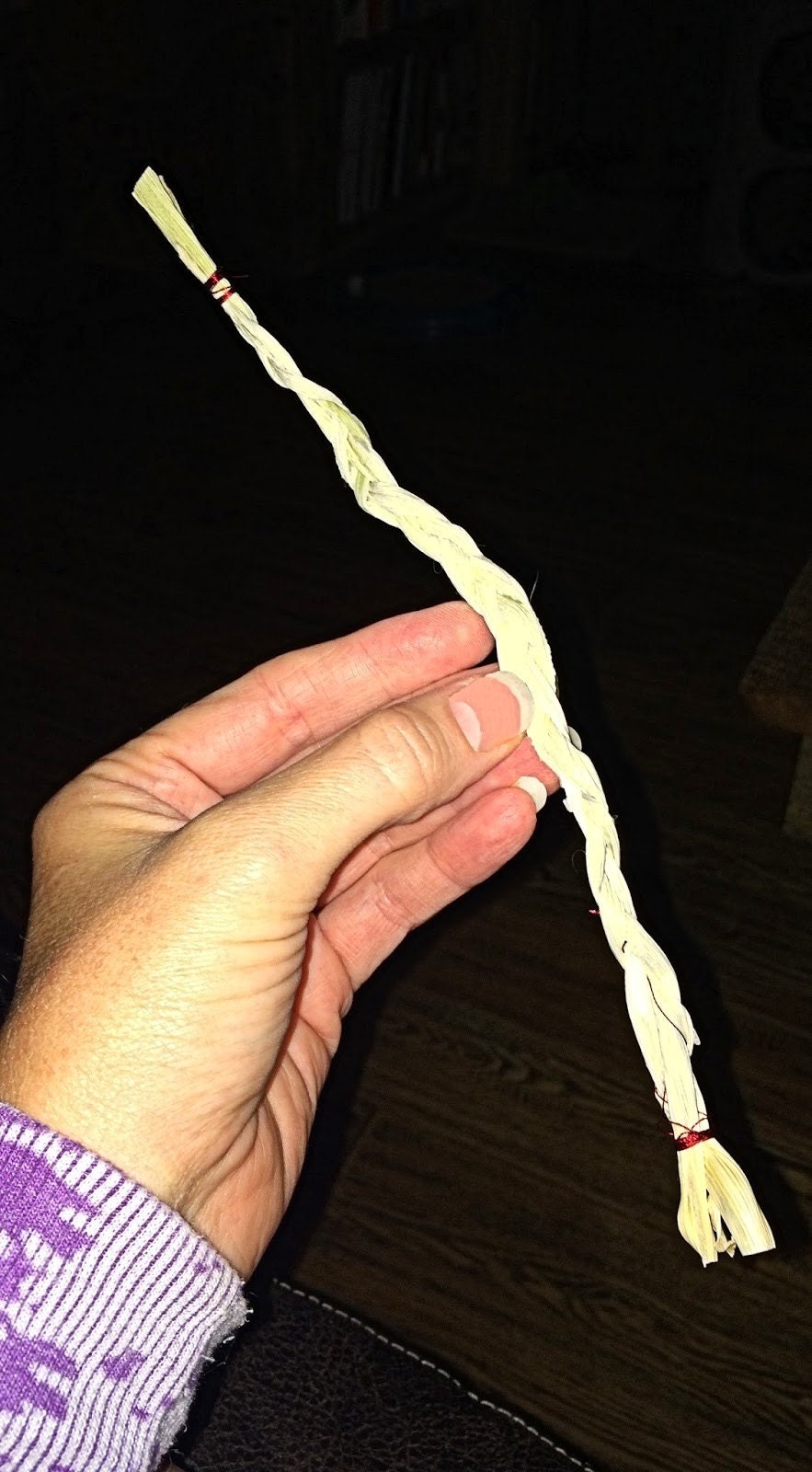 Three husk strips braided together for the corn dolly arms