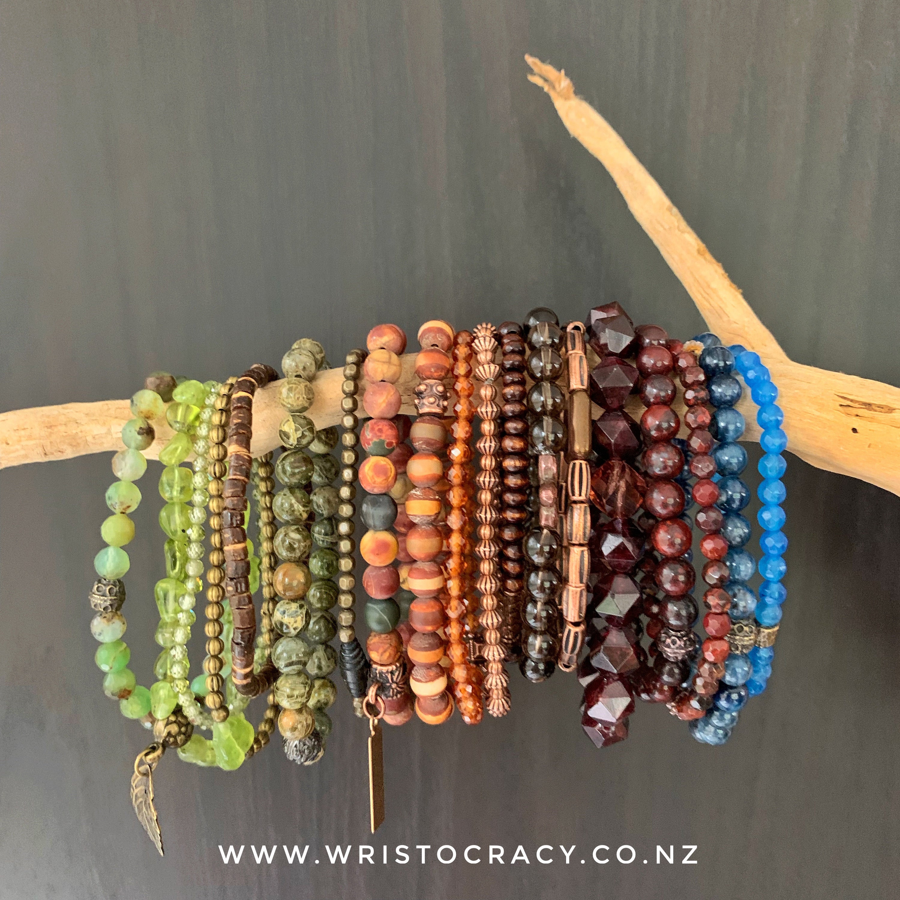 bracelets on driftwood