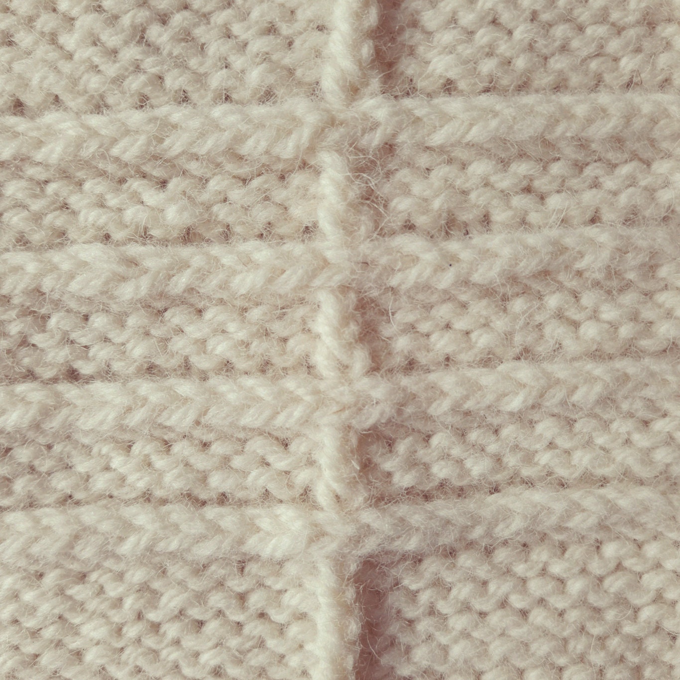 Close up view of horizontal and vertical lines on knitting