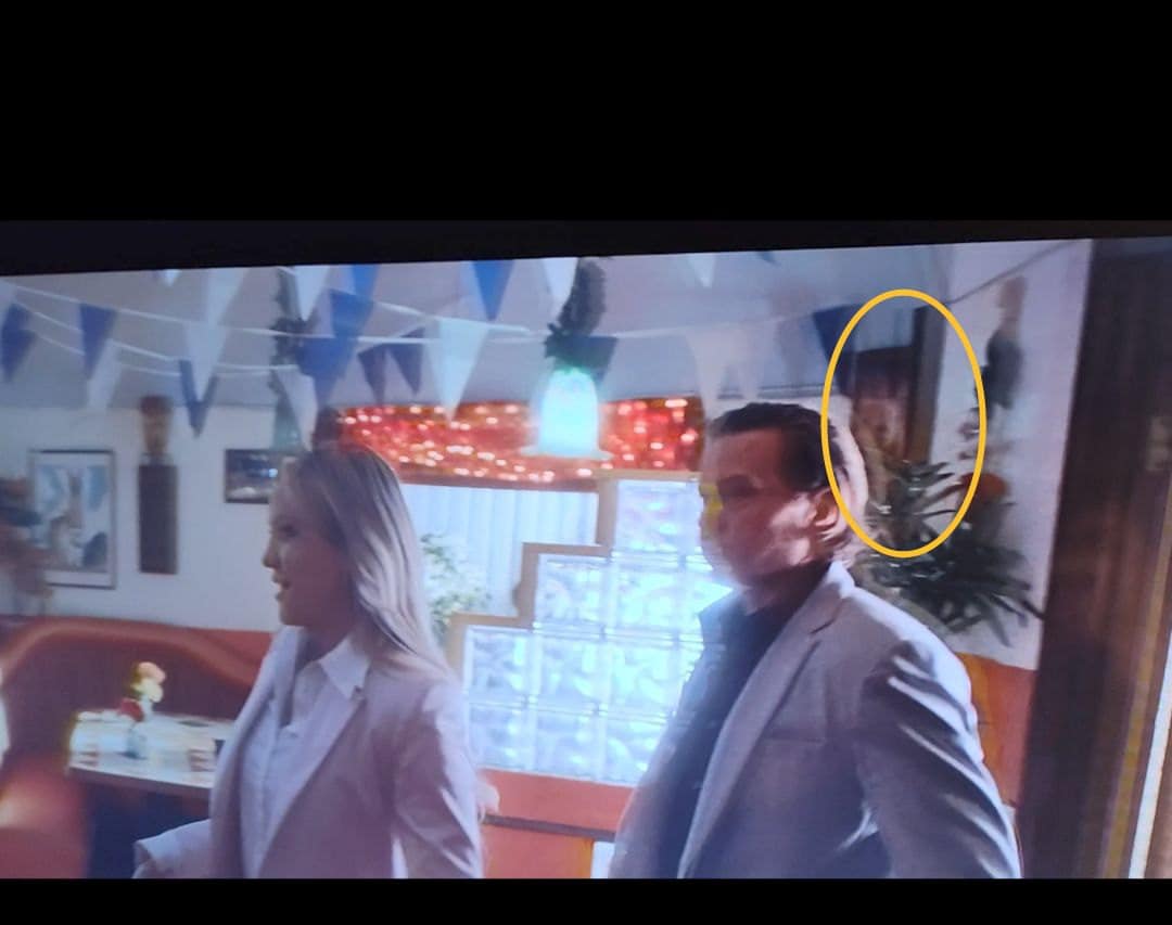 Scene of the main characters just entering the restaurant with a barely visible glance of the second relevant art.
