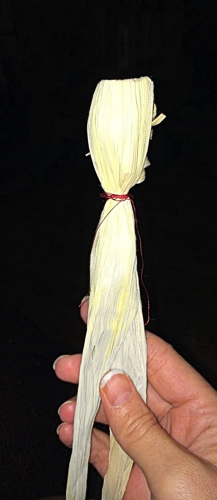String tied around the corn dolly neck to secure the head