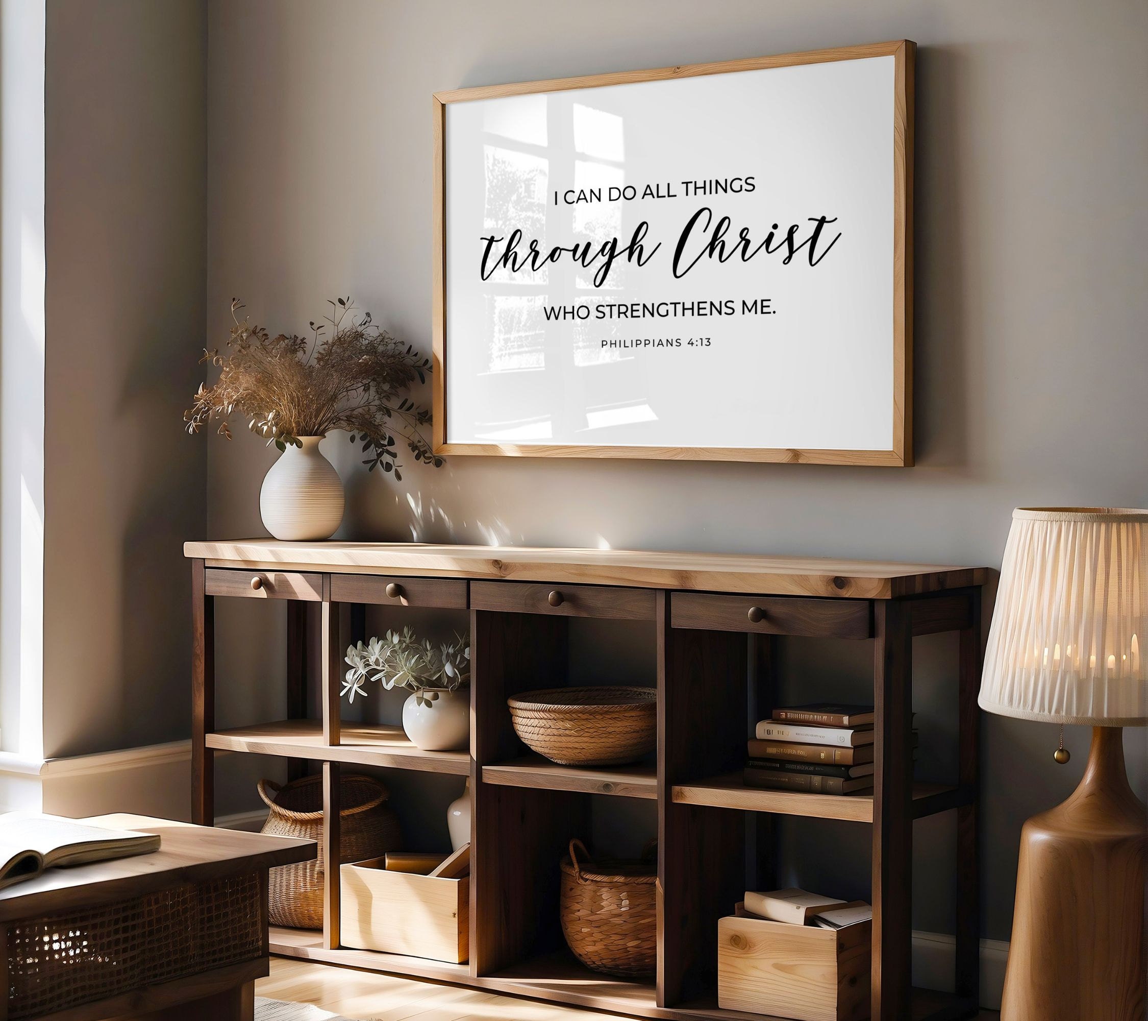 This Philippians 4:13 Bible Verse Poster has a white background and black text. It says, I can do all things through Christ who strengthens me. Its displayed in a modern and minimalistic room.
