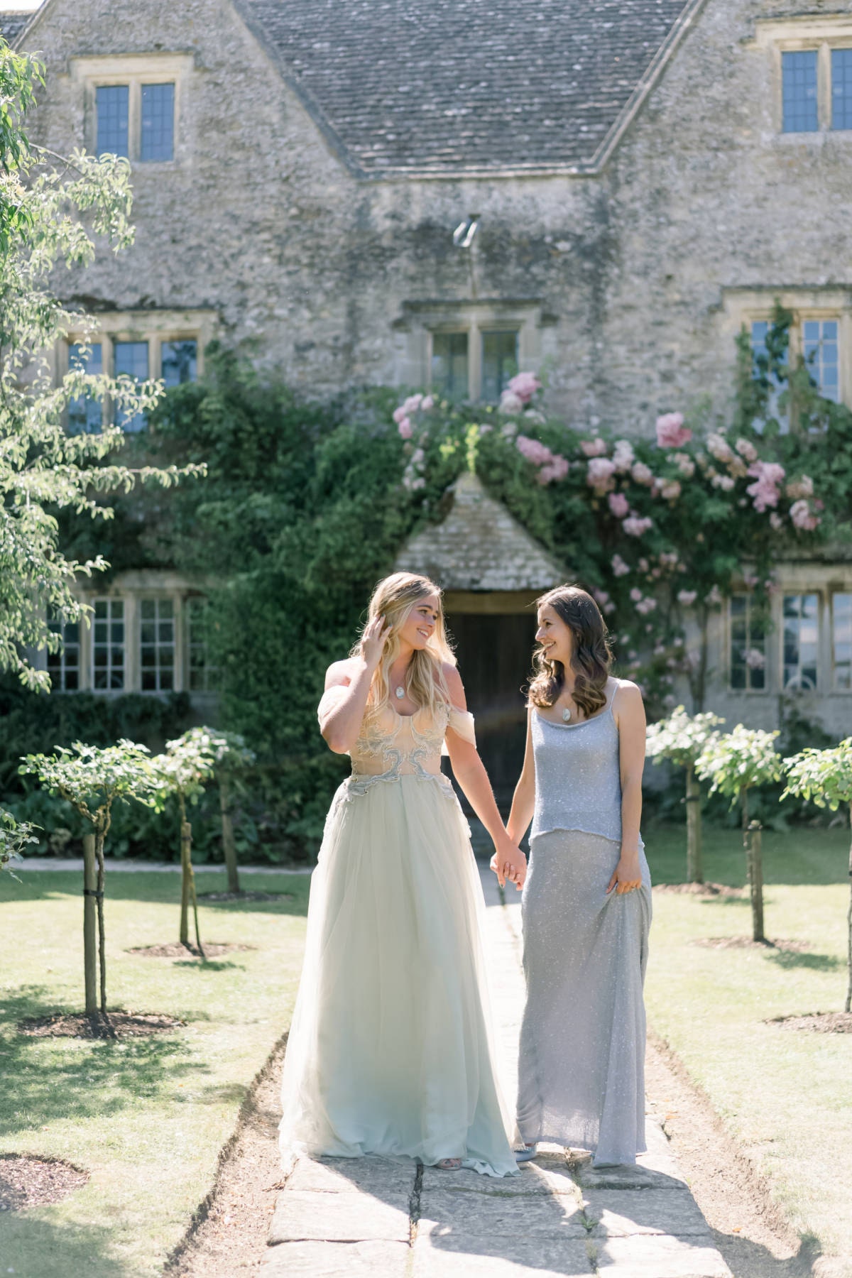 Bride & Bridesmaid wearing custom wedding dress fabric necklaces.