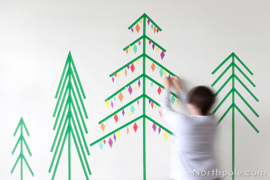 green trees and christmas trees on wall of washi tape