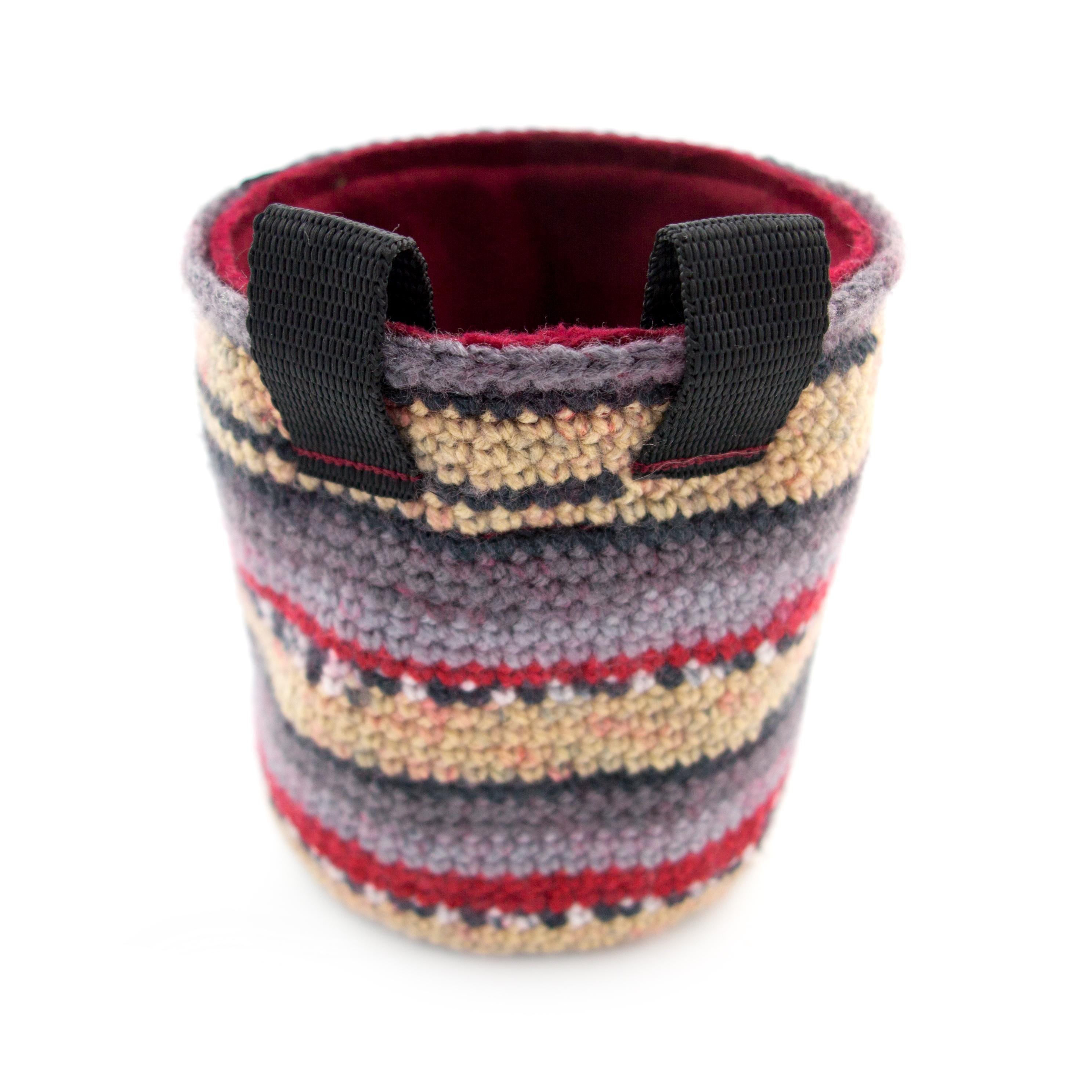 Minimalist striped chalk bag for climbers, featuring a structured open-mouth design that stays wide for quick chalk reach on the wall.