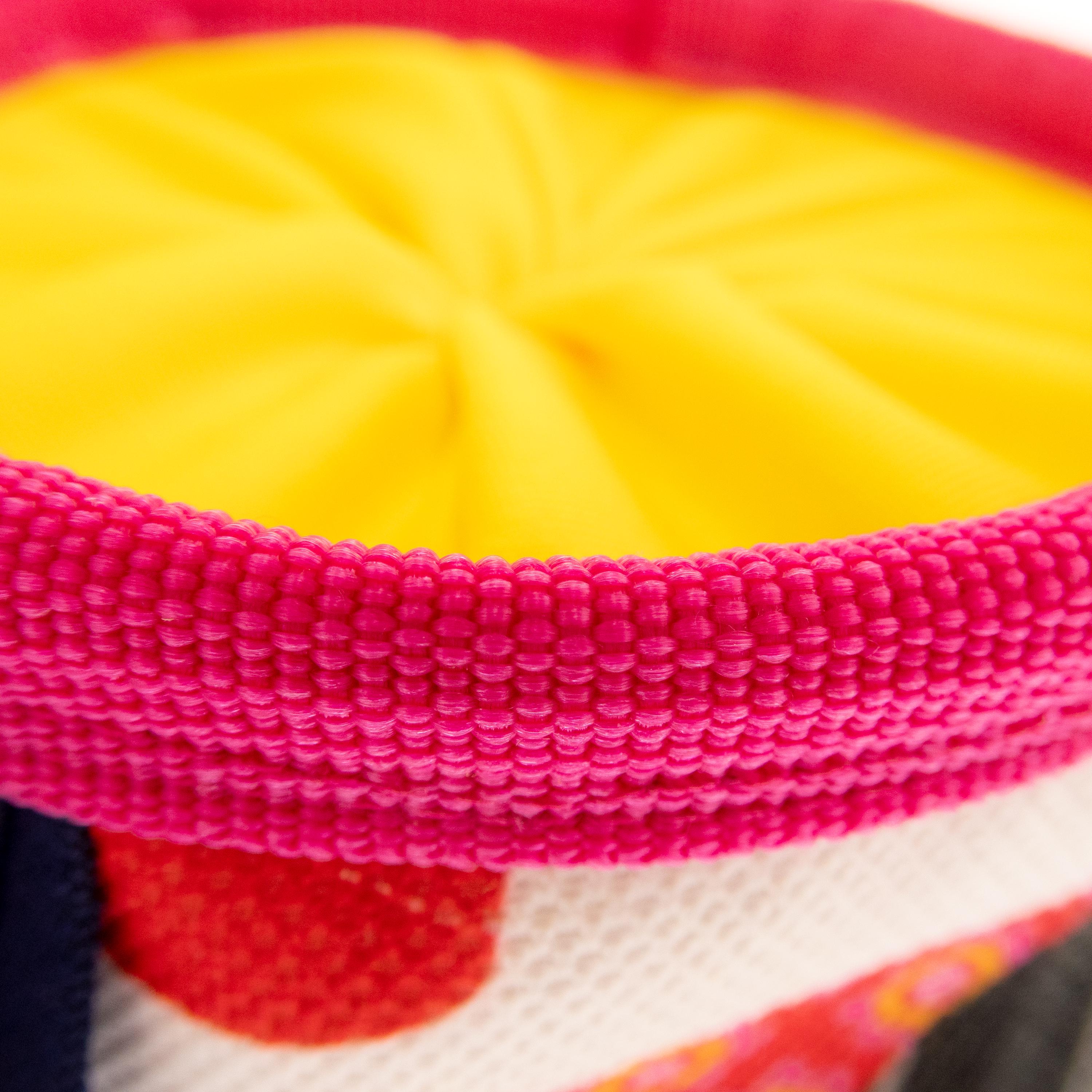 Detailed view of the sturdy upper rib that keeps the small chalk pouch open