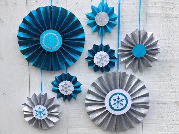 Turquoise, teal and silver glitter hanging medallions for a Frozen-themed or winter party