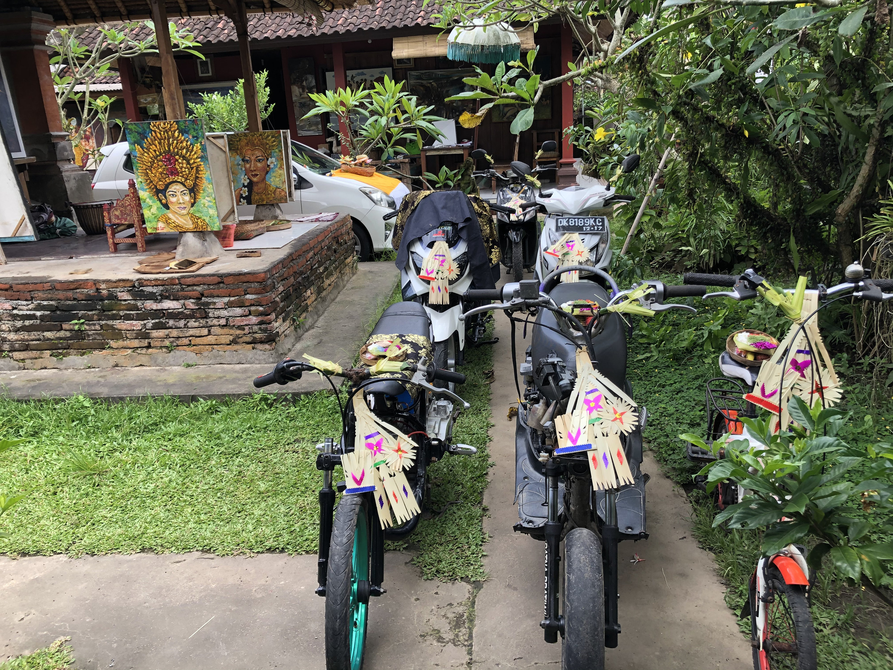 Motorbikes in Dewata Studio prepared for ceremony Tumpek Landep