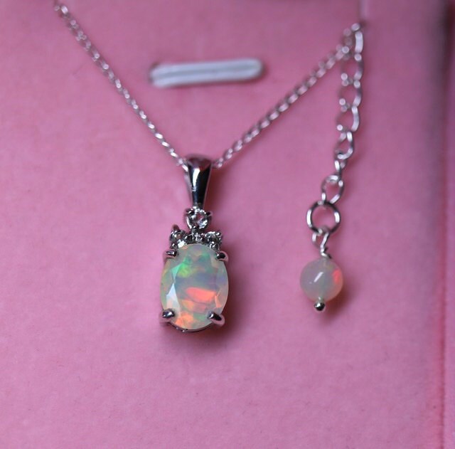 New white opal pendant necklace with 3 accent stones: white topaz, pink tourmaline or natural tanzanite. The accents highlight the colors of the opal in the most flattering way!