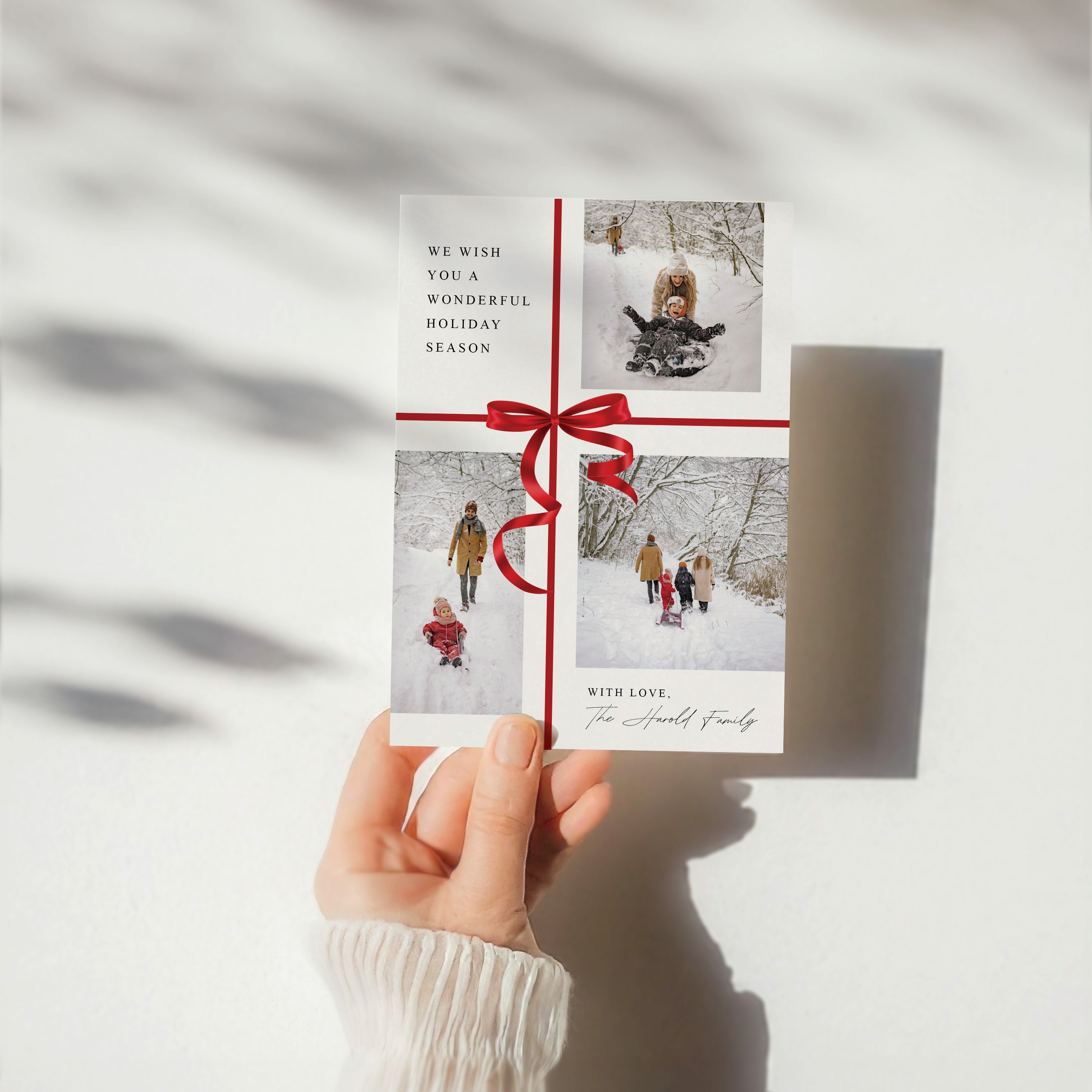 Christmas card in hand