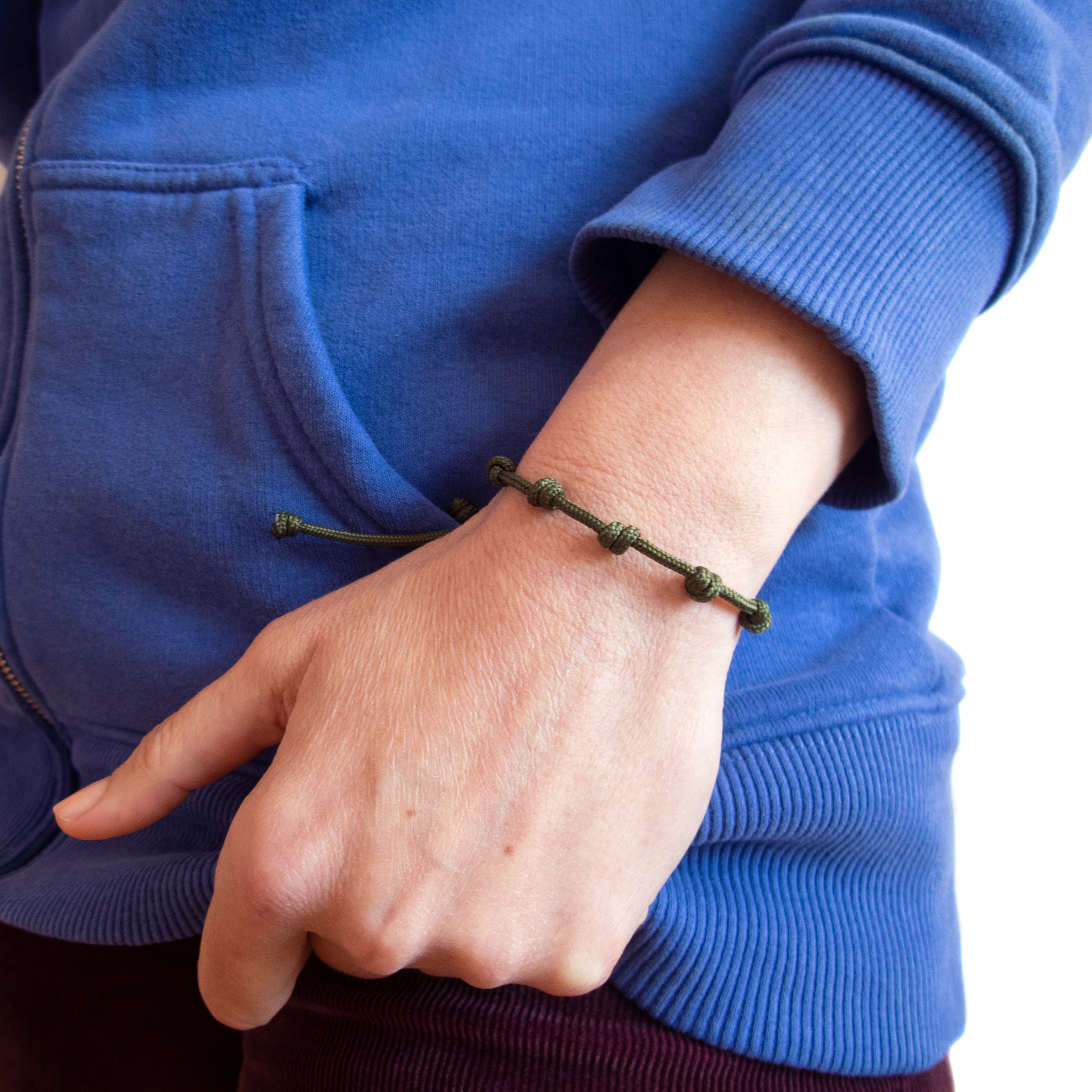 handmade red string bracelet with 7 knots