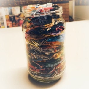 jar of thread off-cuts