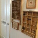 Even the entryway is full of life and stories, thanks to Carolyn’s printer’s type drawer display and rotating x-stitches.