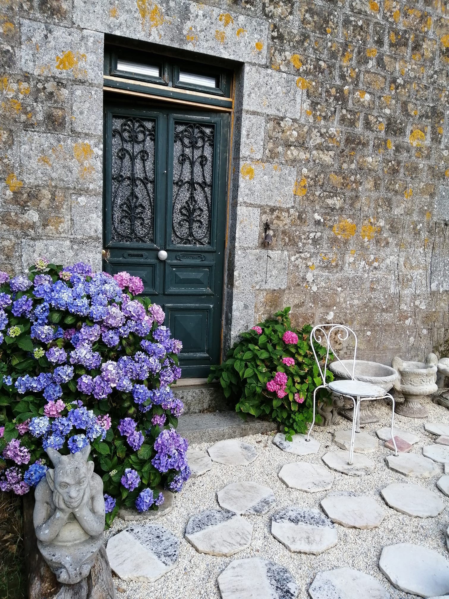 The terrace of Caen stone pavoirs is a sunny spot to enjoy coffee