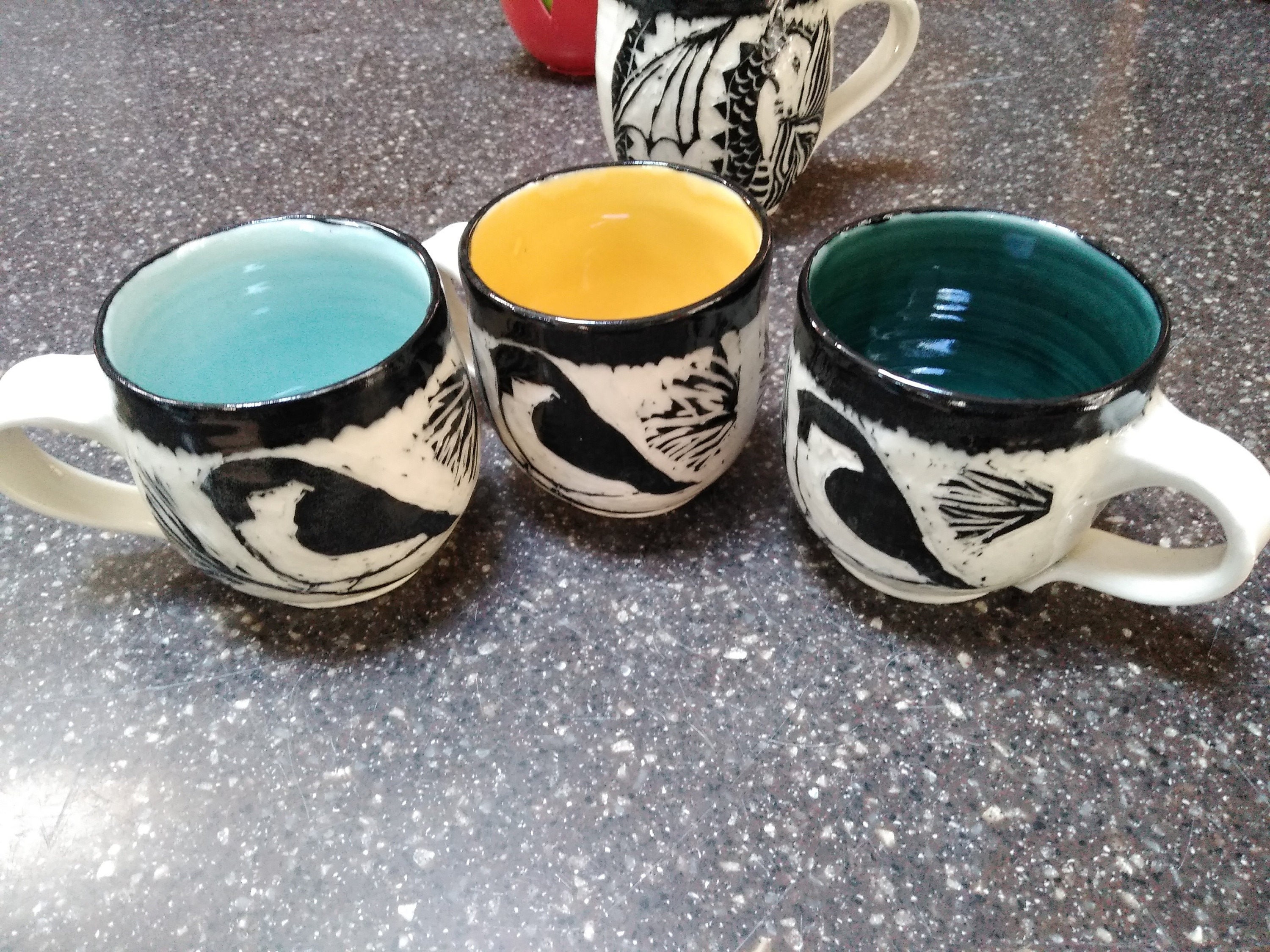 Here is a photo of the new glaze in a chickadee alongside a new yellow chickadee and a forest.  I had hoped for a bit more turquois
