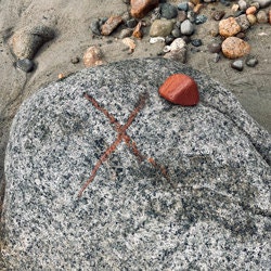 Drawing upon rock with beach brick by Wendy Joubert