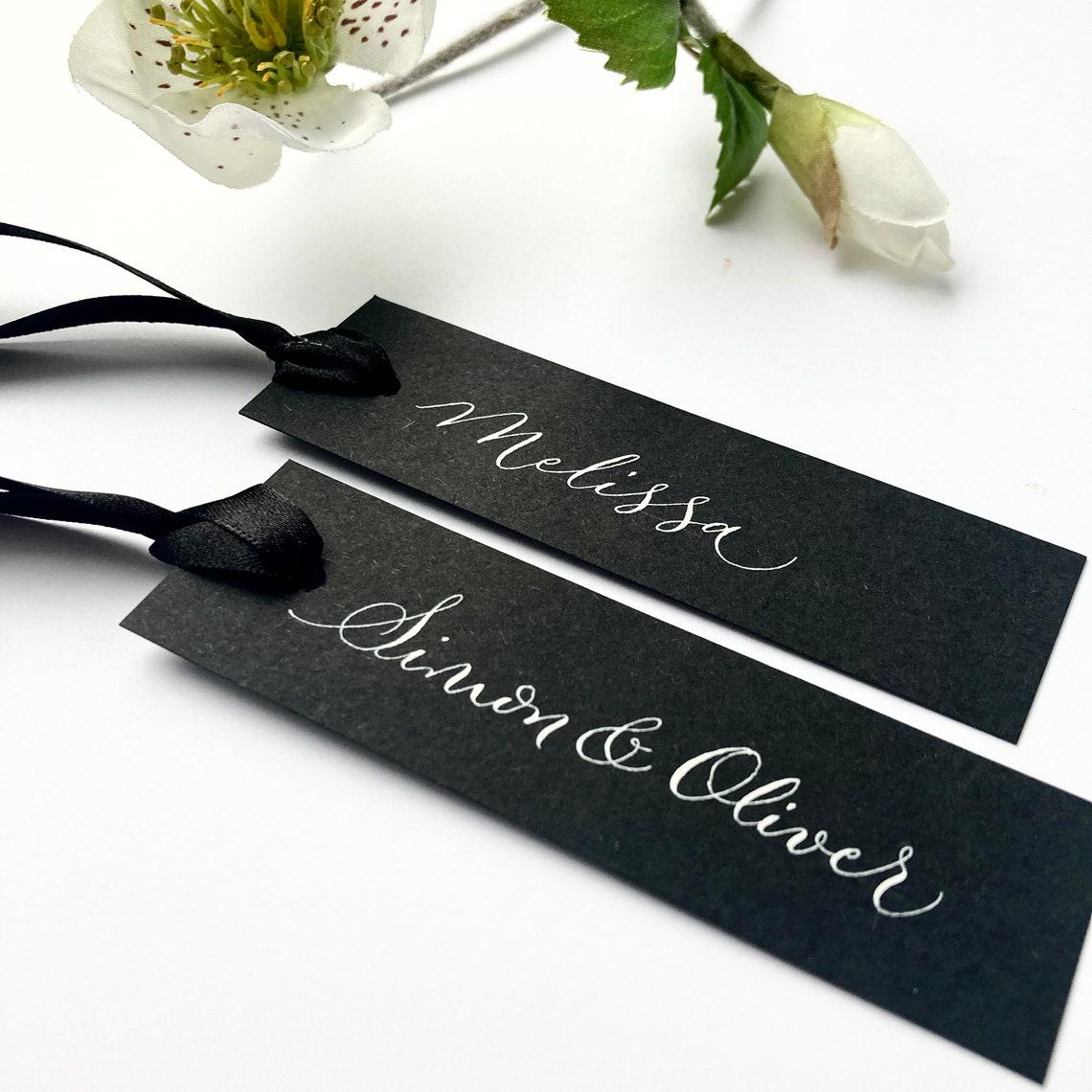 slimline black wedding place names in calligraphy