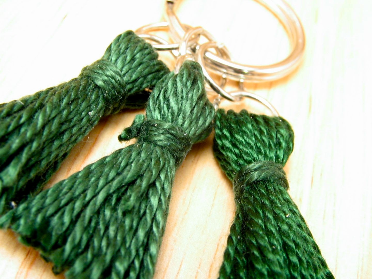 Three zipper pulls on a larger ring