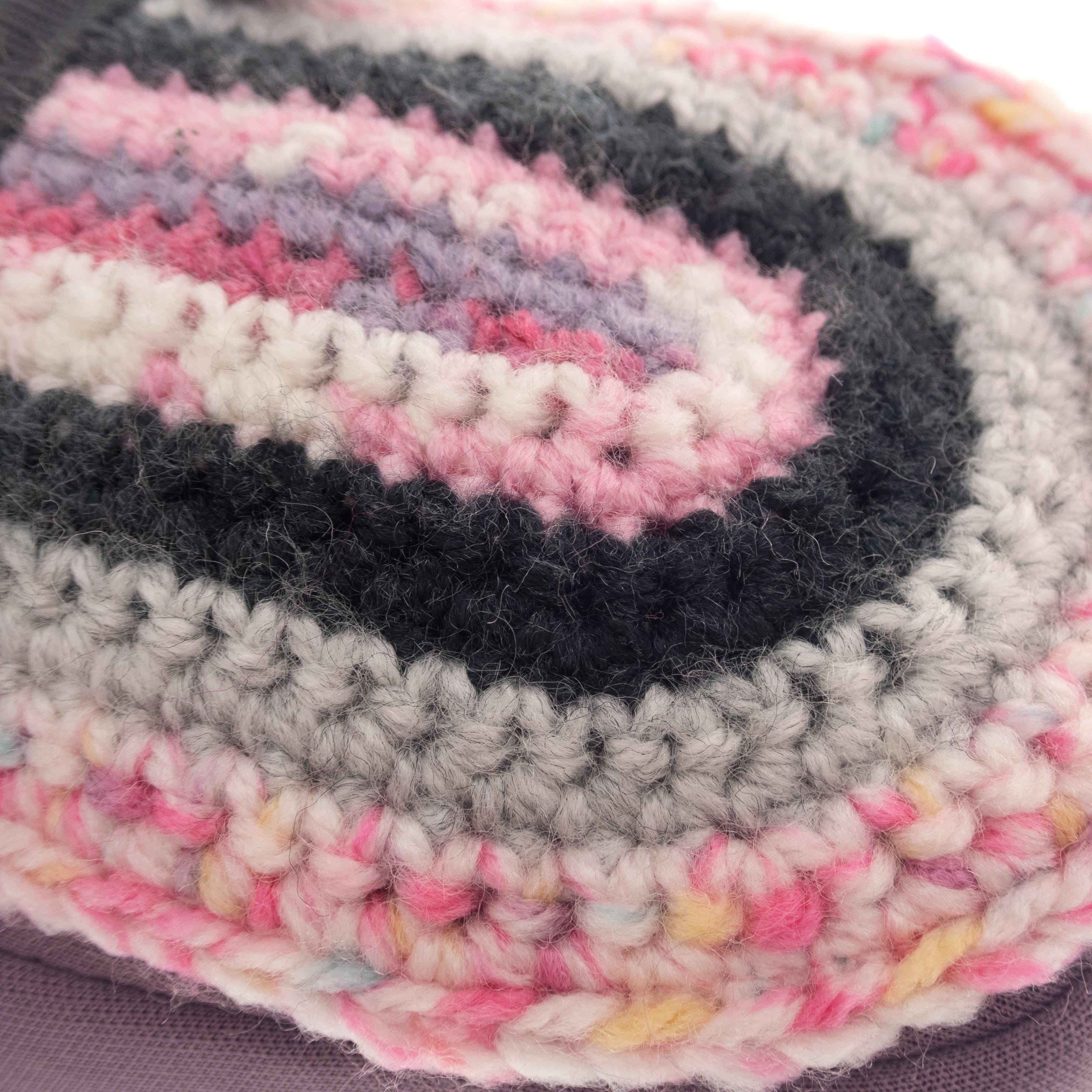 Childrens climbing chalk holder with handcrafted knitted detail, designed for comfort and easy chalk access.