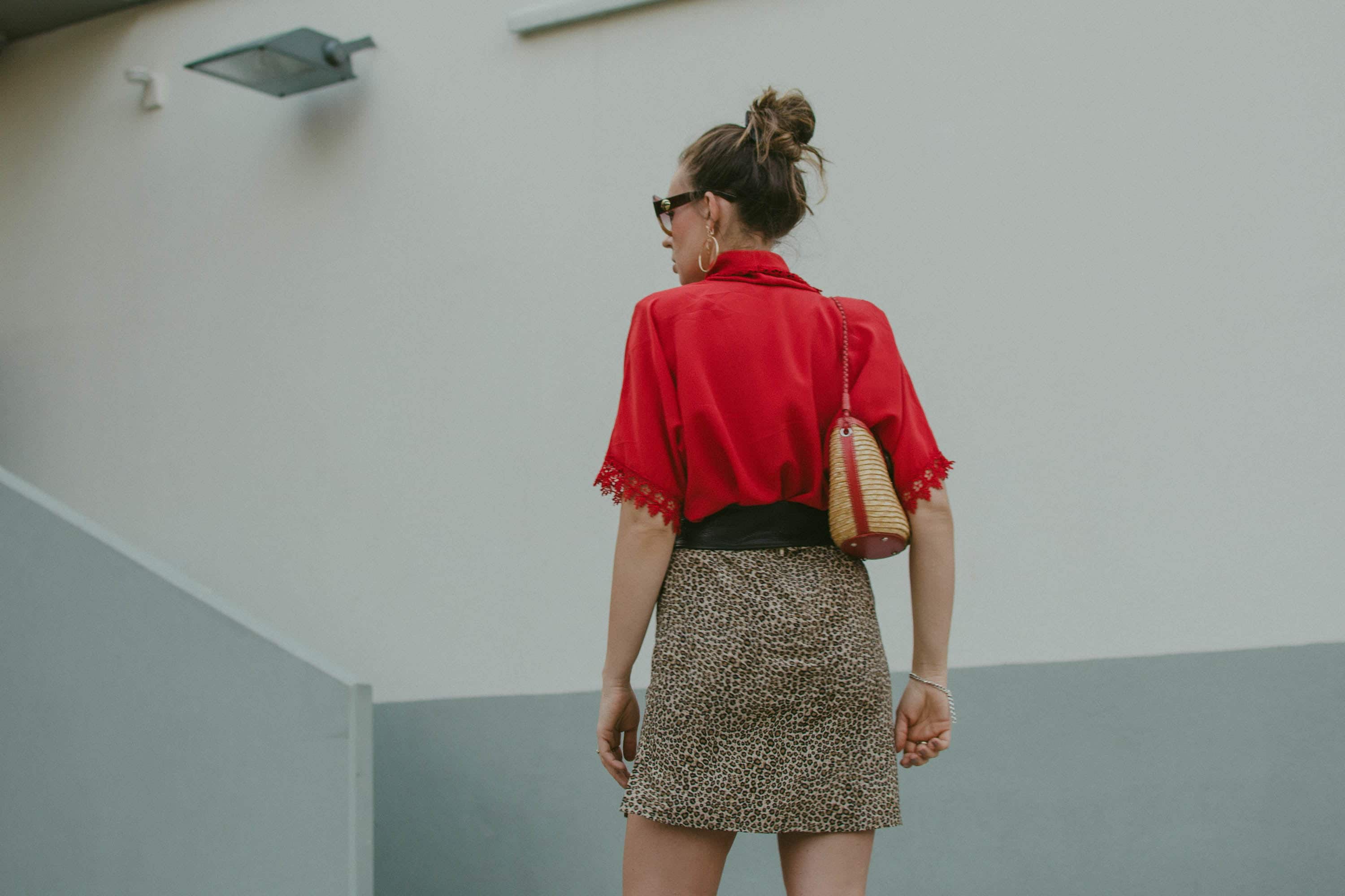 red blouse and leopard mini skirt