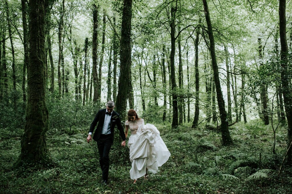 Bride and groom in lush green nature