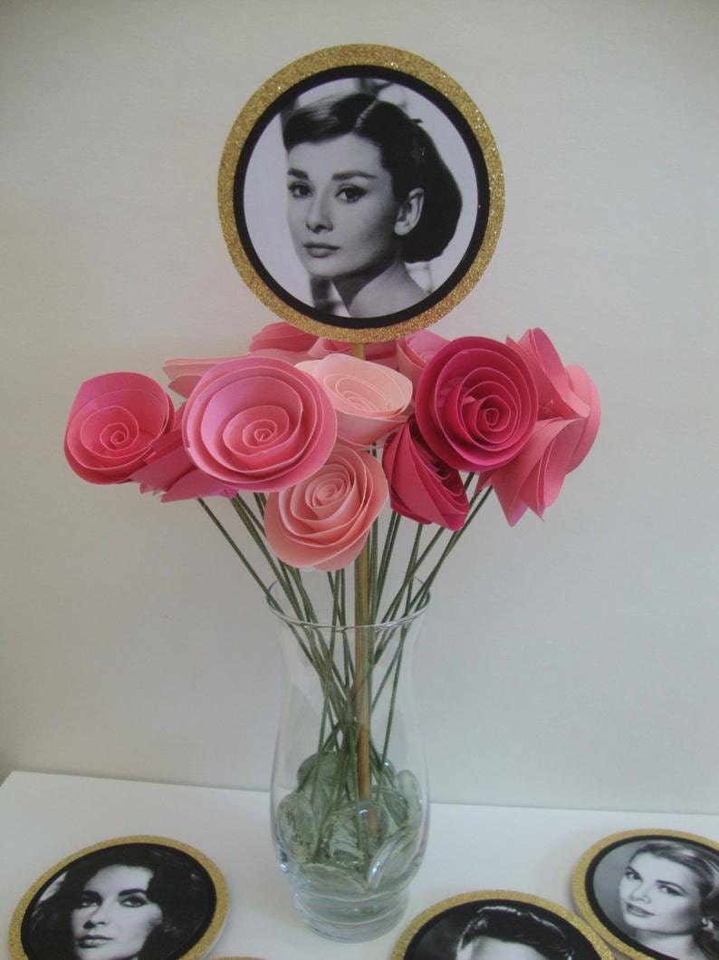 black and white picture on gold glitter circle as centerpiece with rolled paper flowers