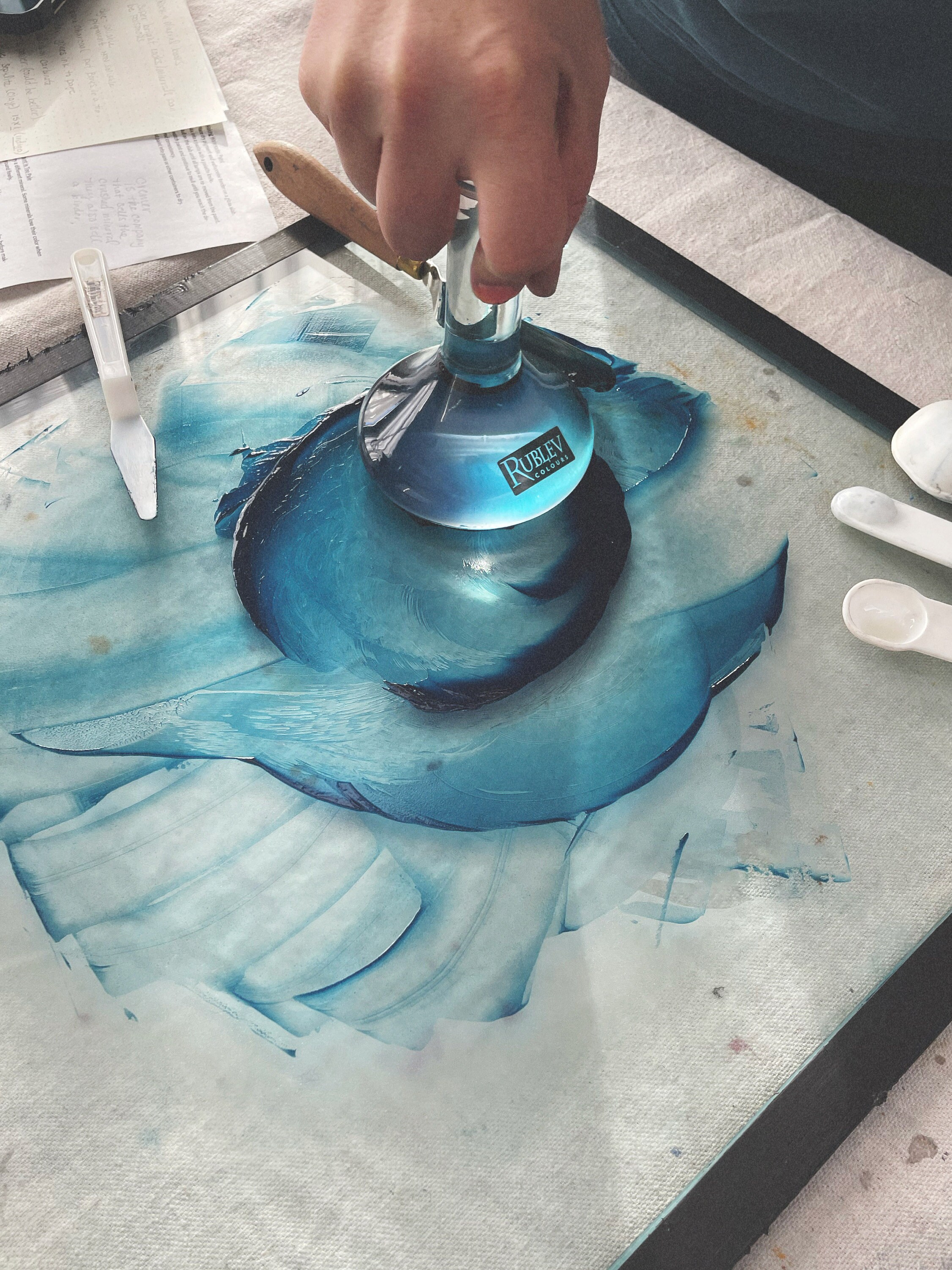 Mulling Maya Blue pigment.